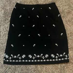 Black mid length skirt with floral deign